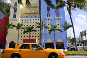 Yellow cab with Miami Beach Florida buildings