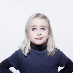 Naklejka premium studio portrait of a caucasian cute sulk litle girl