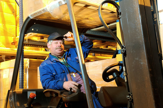 forklift loader worker at warehouse