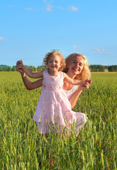 Happiness mum playing with a daughter