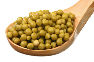 Green peas in a wooden spoon
