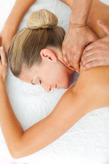 Obraz na płótnie Canvas Asleep woman enjoying a massage
