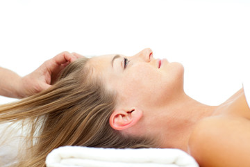 Obraz na płótnie Canvas Attractive woman enjoying a head massage
