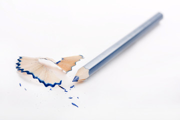 Sharpened pencil and wood shavings.