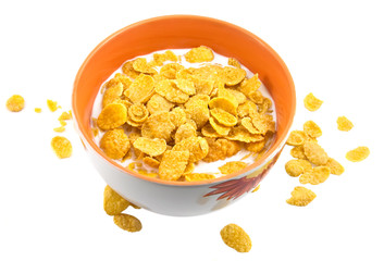 Bowl with corn flakes and milk on the white
