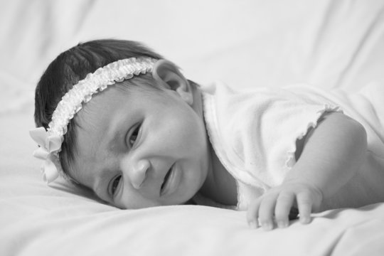 Black and white image of a cute newborn baby