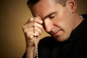 Fototapeta na wymiar Praying priest