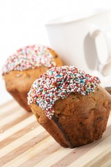 Tasty muffins with cup of tea