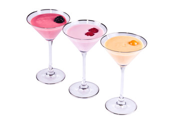 Three bright multi-coloured cocktails