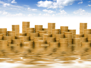 Golden coins against the blue sky