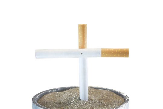 A Isolated Cigarette cross in ashtry