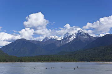 tibet: lake, mountain, white cloud and blue sky