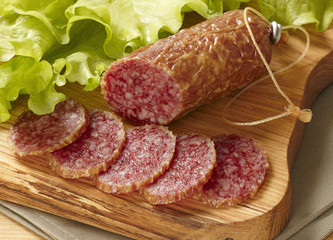 sliced salami on cutting board