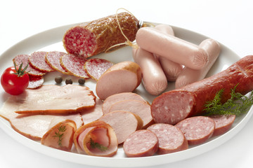 meat and sausages on white plate