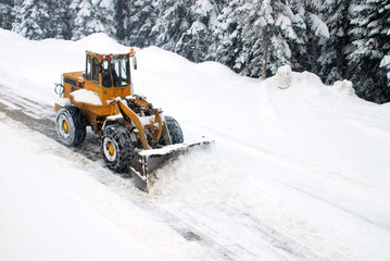 A snowplow clearing a road
