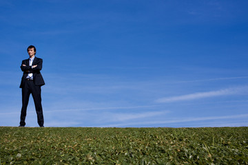 Business man on a hillside