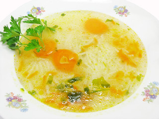 yellow soup with pasta