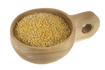 scoop of hulled millet grain