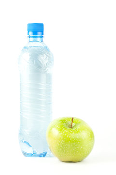 Bottle of watewr and green apple