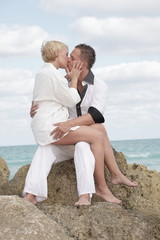 Young couple sitting and kissing