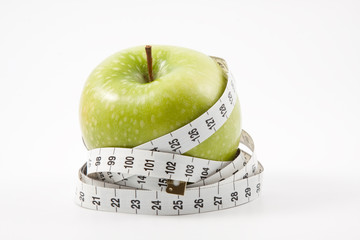 Apple and measuring tape