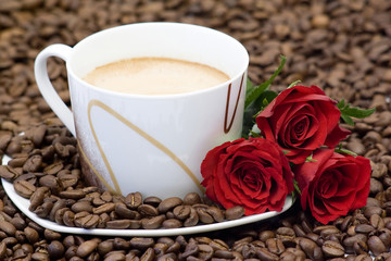cup of coffee and red roses