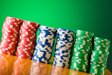 Stack of casino chips against gradient background