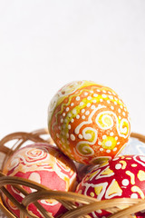 colorful Easter Eggs in wicker basket