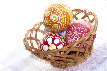 colorful Easter Eggs in wicker basket