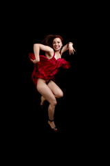 Woman in red dress dancing