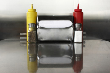 Napkin dispenser and condiments © Peter Kim