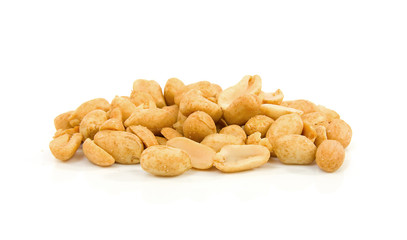 Pile of salted peanuts over white background