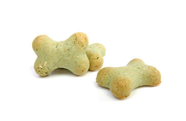 Green dog cookies over white background