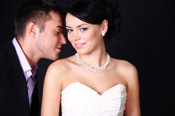 Loving couple standing in the studio