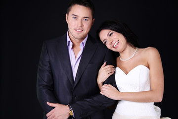 Loving couple standing in the studio