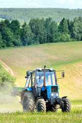 Tractor in a field in early summer