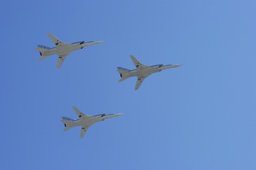 The group of planes against the dark blue sky