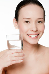 Young and attractive woman with a glass of water