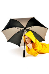 pretty woman lying under umbrella