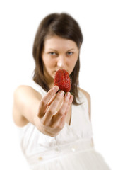 sexy young woman holding fresh strawberry