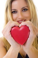 woman holding a red heart - closeup