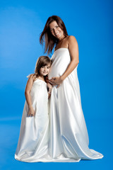 Fototapeta na wymiar Pregnant woman with her daughter