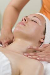 Fototapeta na wymiar Young Woman Having Facial Treatment or Massage at Health Spa