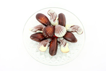 Sweet chocolate shellfish on glass plate