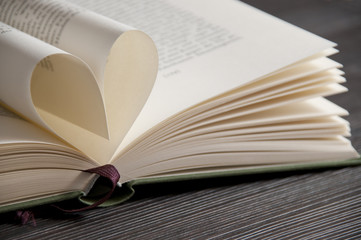 Love reading - book pages forming heart shape