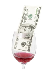 dollar bill inside cracked wine glass with lipstick imprint
