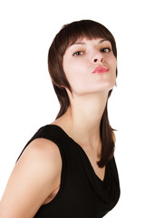 The young girl shows a mimicry a kiss on white background