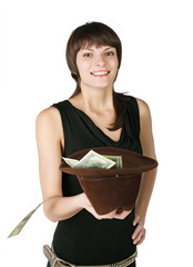 The girl holds a hat in which put dollars, isolated on white