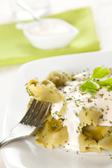 dish of tortellini with cheese sauce