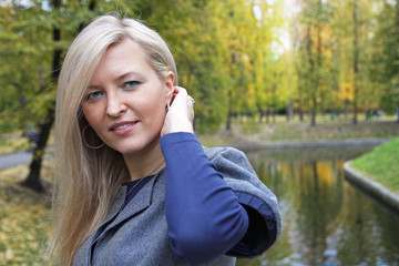 Portrait of the girl in autumn park